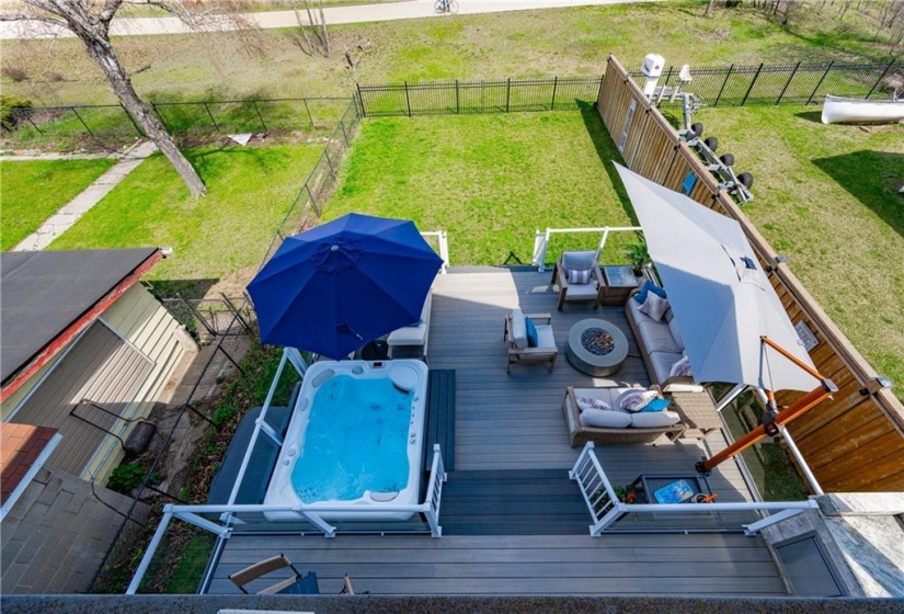 The yard is fully fenced in with concrete walkway installed on the west side. The east provides great storage for kayaks, canoes or paddle boards!