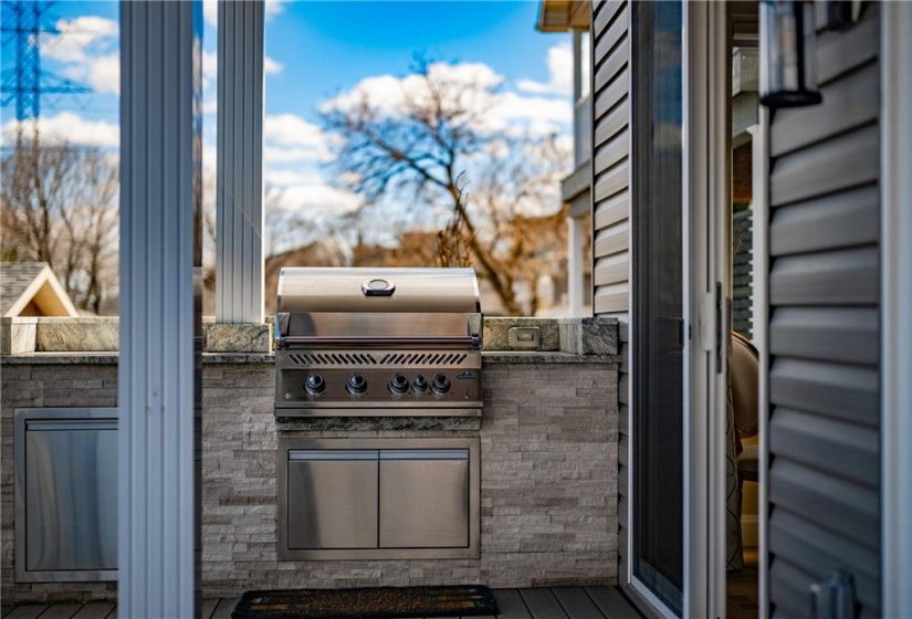 A Napoleon Gas Line Outdoor Kitchen [including rotisserie & storage cabinetry] brings your kitchen outdoors with you. Covered from above, your grilling season is extended as long as you’d like it to be. Additional electrical outlets prove useful for other small kitchen appliances.