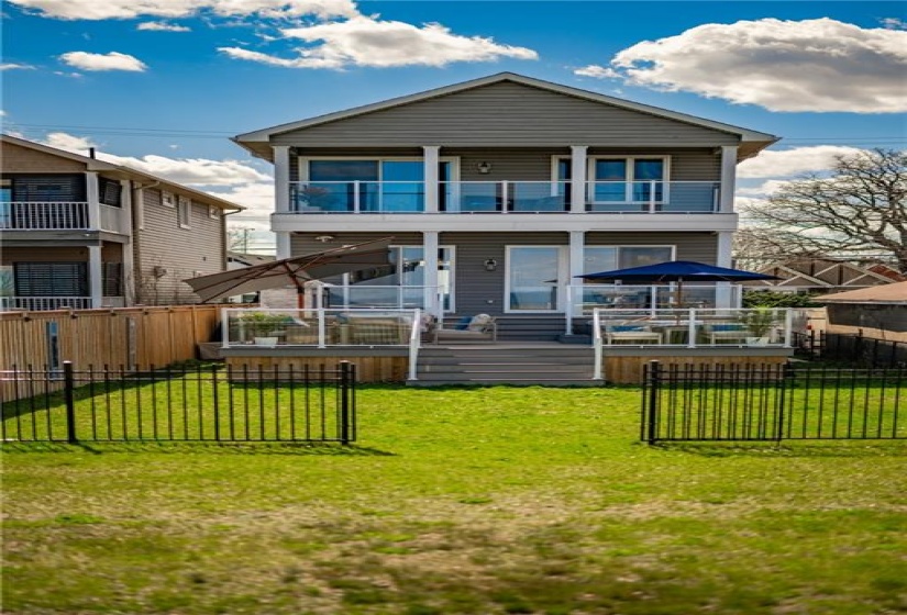 Picture-perfect as viewed from the waterfront. Room to spare in the rear yard to add gardens of additional patio space.