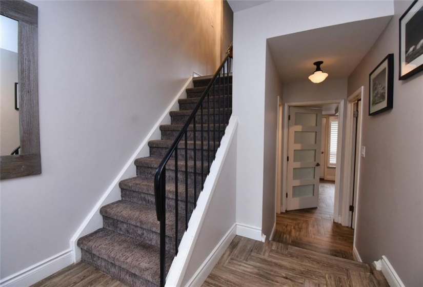 - ground level foyer, hallway to Family Room; staircase to 2nd level