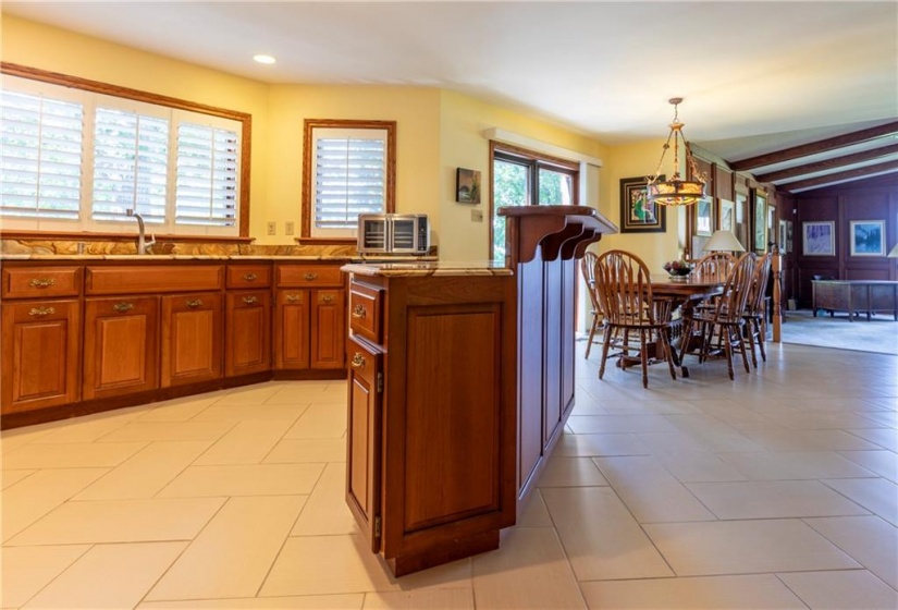 Custom Barzotti Cherrywood Kitchen and Granite Counters. A Walk-in Pantry/Main Level Laundry is nearby.