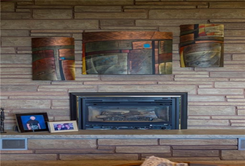 The floor to ceiling stone fireplace surround emphasizes the full 10'6