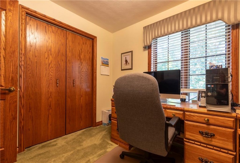 Currently used as a home office, the fourth bedroom makes for an excellent nursery adjacent to the primary bedroom.