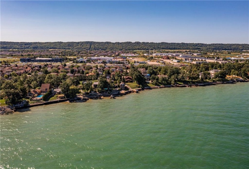 The shoreline is protected from erosion while the home sits safely on high ground and set back from neighbouring homes to create additional privacy.