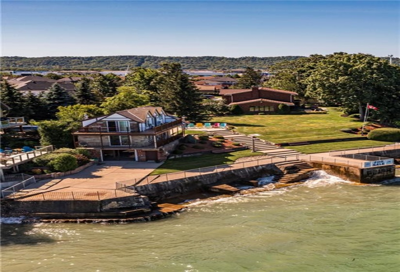 A separate boathouse offers a secondary structure connected to hydro, water and connects to the septic system.