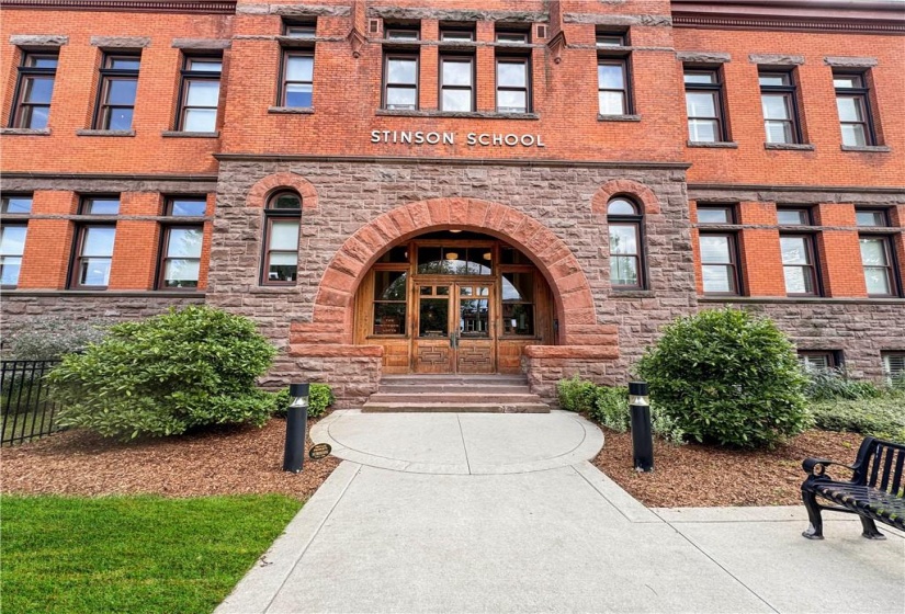 built in 1894, the grand oak doors still have kid's initials carved in the wood