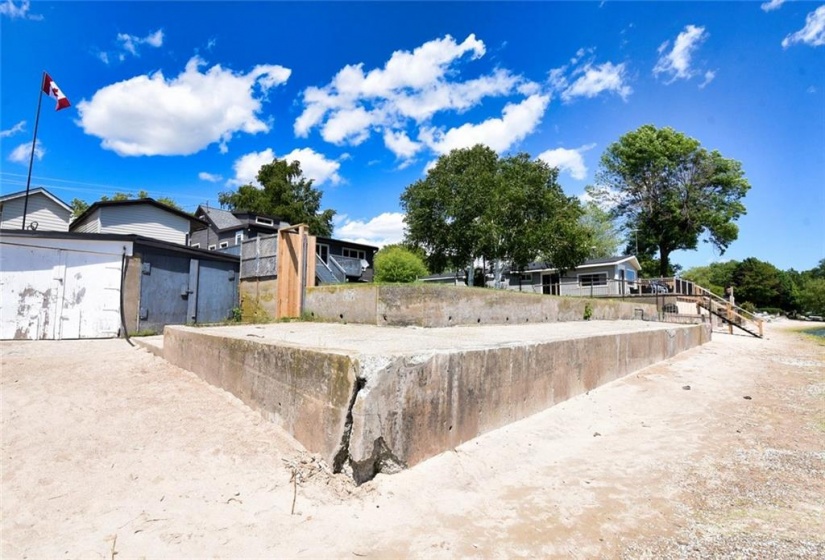 Shared boat house and break wall