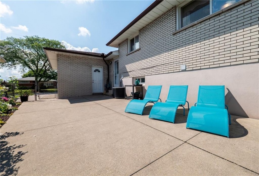 Fully fenced in yard with concrete patio