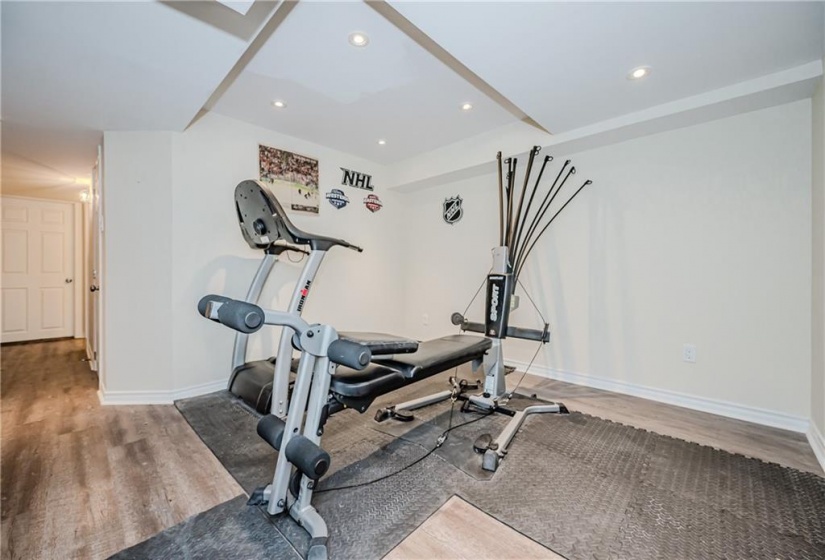 The home gym is tucked just outside of the main space. Could make for a great open office for those who work from home or a kid-friendly play space.