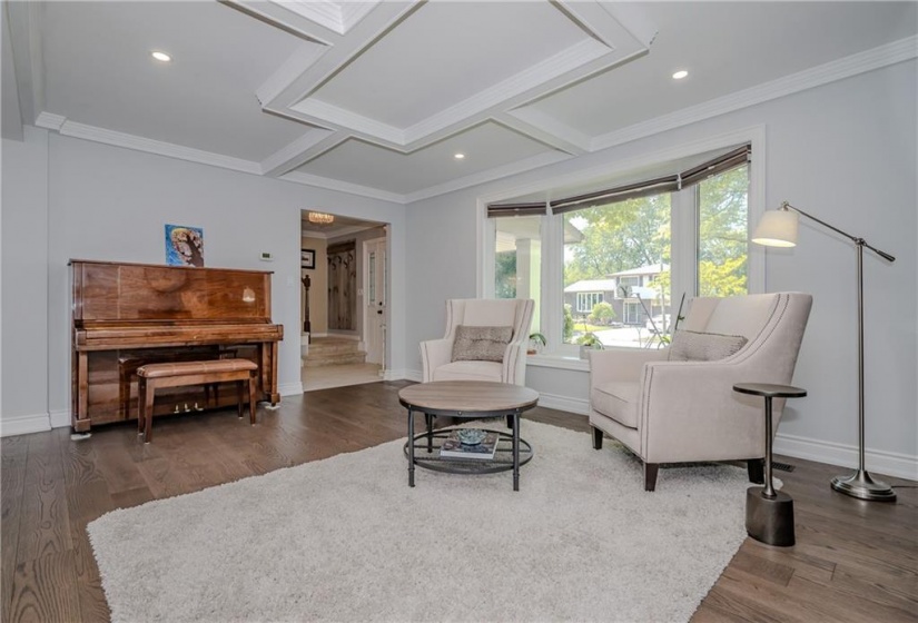 Dual accent walls in the living and dining room help to define each space while hardwood floors create a cohesive look throughout the main floor.