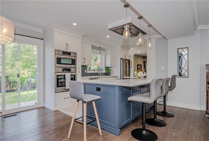 The induction range offers a low profile, minimalist look while the overhead exhaust fan (remote controlled) creates the experience of a high end kitchen. Storage components and organizers found within this incredible versatile kitchen island.