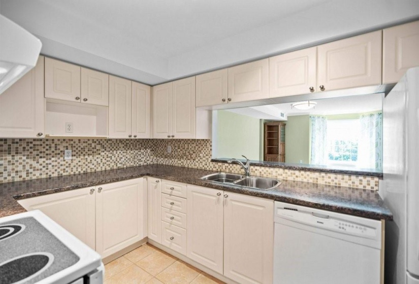 Generous sized kitchen with loads of cabinets and counter space!