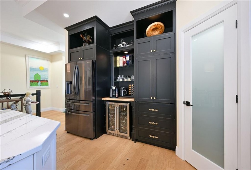 Pantry on right has power and roll-out drawers for coffee makers, toaster and microwave.