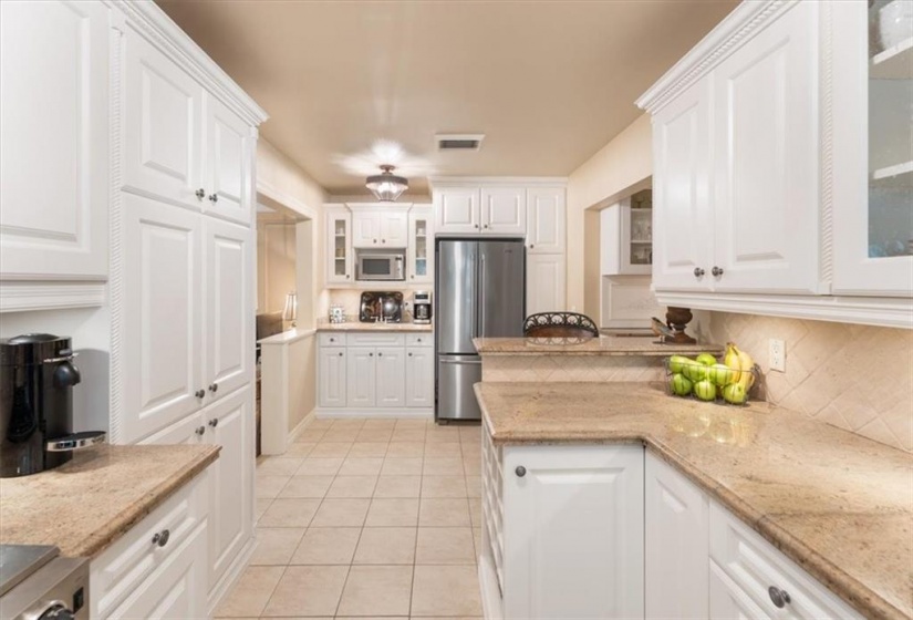 Granite countertop, tumbled marble backsplash