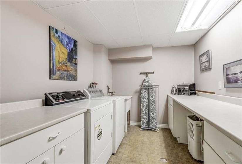 spacious laundry area in lower level