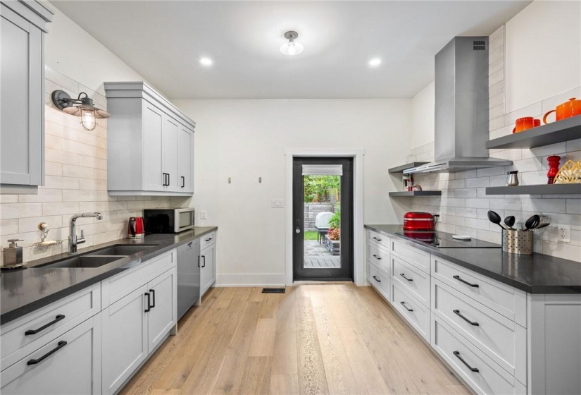 Kitchen on main-floor: new exterior door (2018) leading to backyard