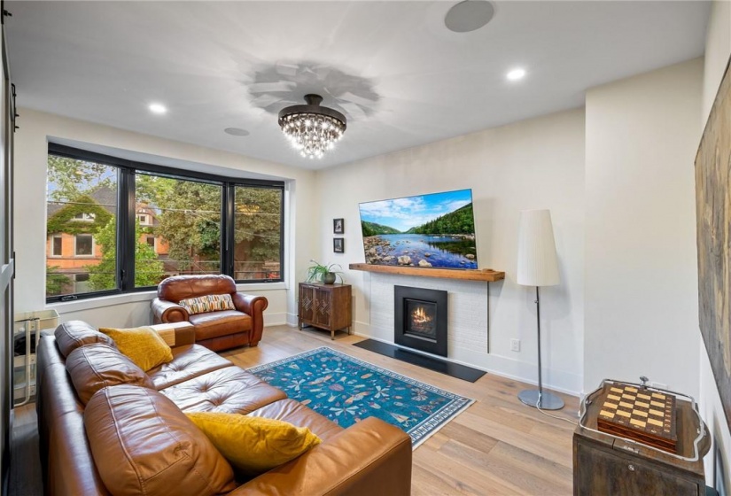 Living room in upper unit (2nd flr). Note the gas fireplace!