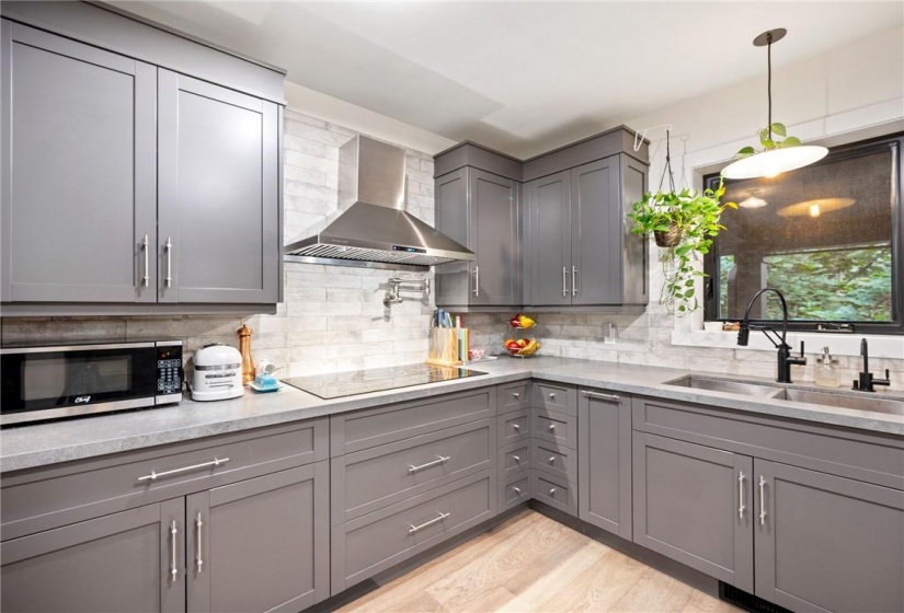 Kitchen in upper unit (2nd flr). Quartz countertops!