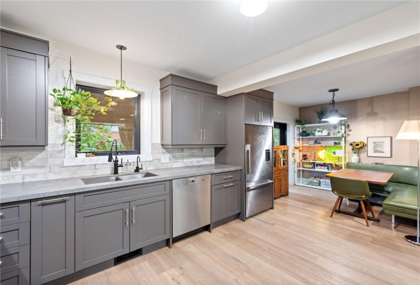 Kitchen in upper unit (2nd flr). Miele dishwasher, restoration hardware lighting