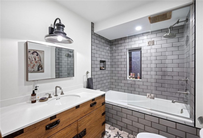 STUNNING 4-piece bathroom in upper unit (2nd flr). High-end fixtures, tub, and toilet.