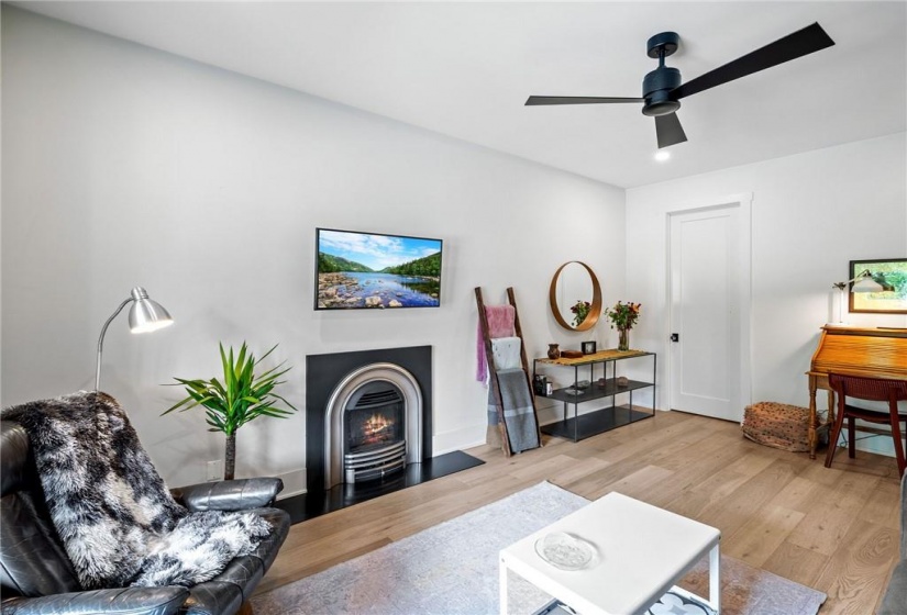 Living room on main-floor. Note the ceiling fan!