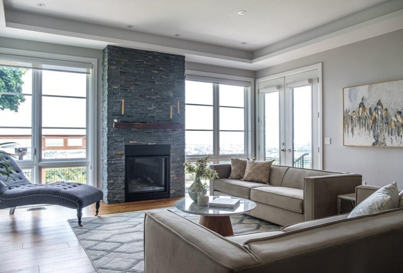 Hardwood Floors, Floor To Ceiling Windows and Fireplace