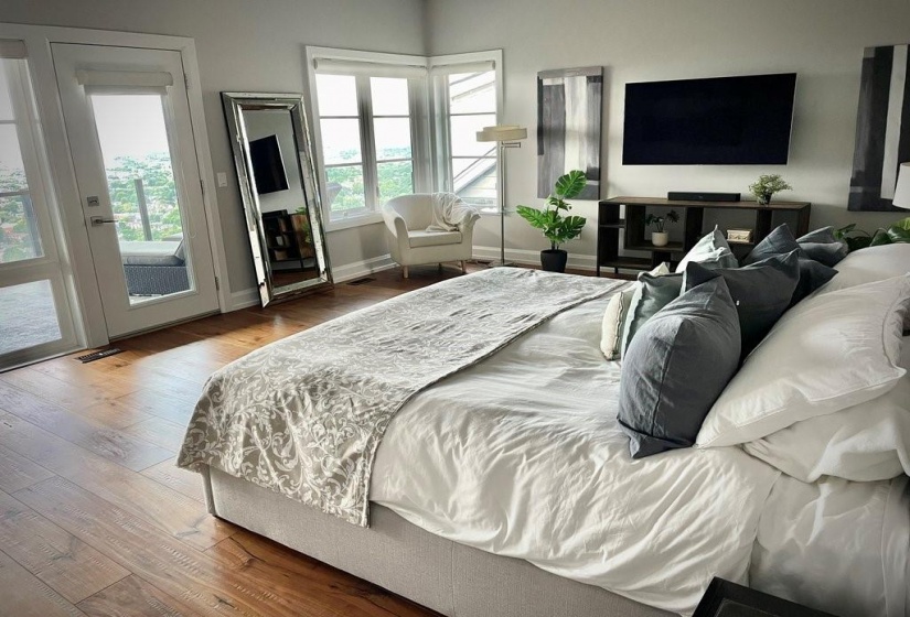 Primary Bedroom, Gleaming Hardwood, A Wall Of Windows Looking  Out to Lake Ontario