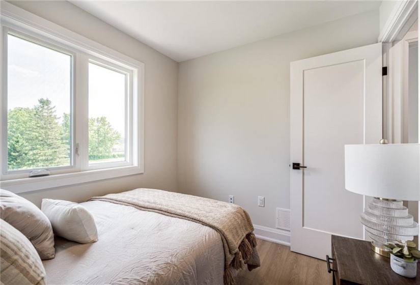 Second bedroom with garden views