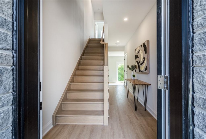 Foyer with hallway leading to additional living space