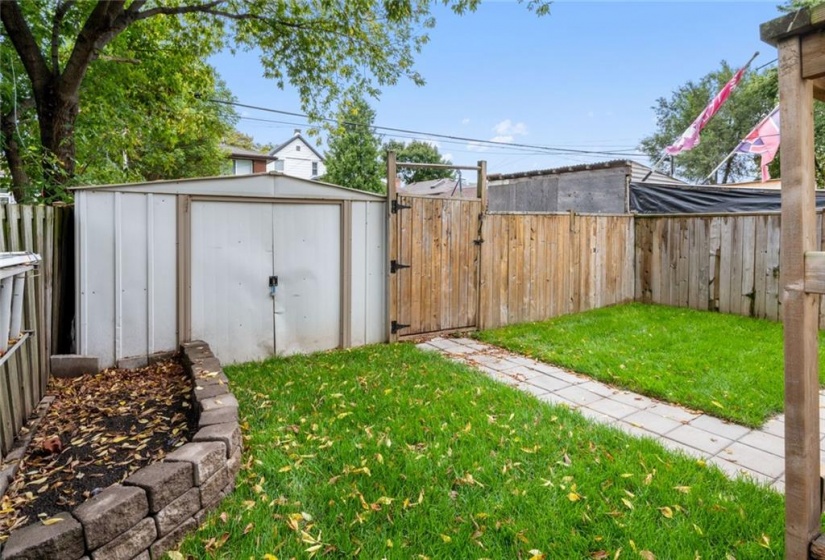 Two parking spaces behind fence